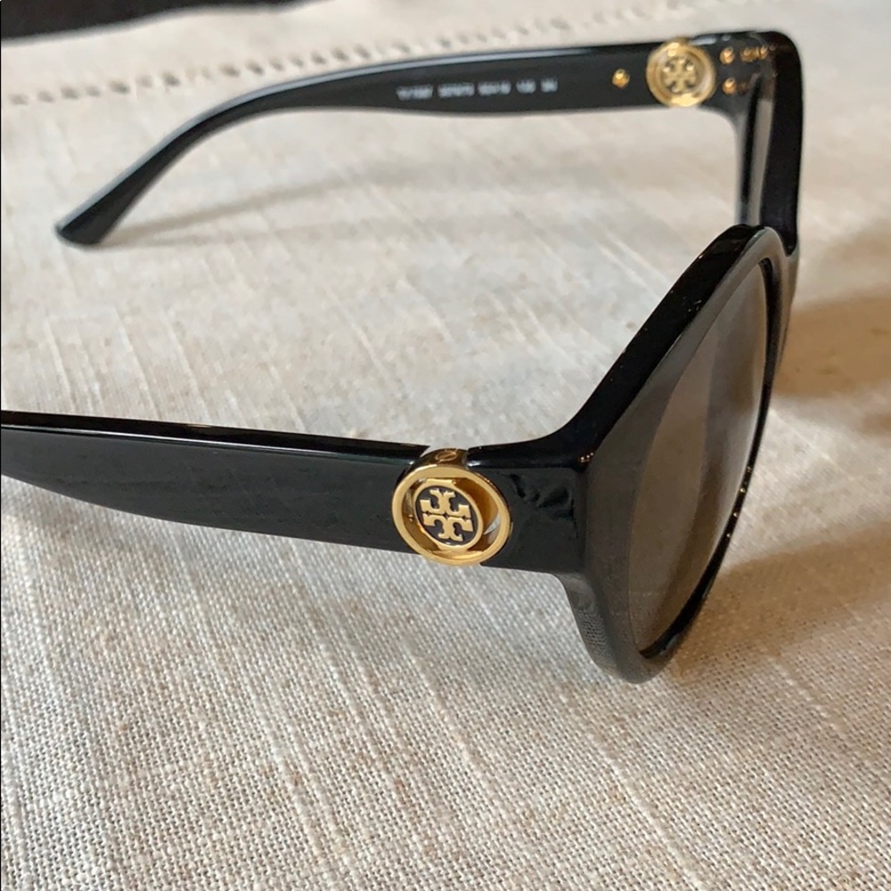 Tory Burch black sunglasses with gold emblem.